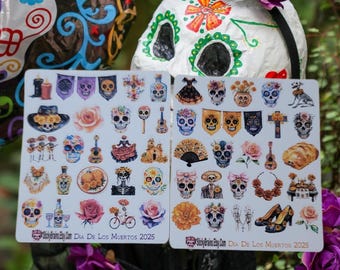May include: Two rectangular sticker sheets featuring various watercolor illustrations related to Dia de los Muertos, including skulls, flowers, guitars, and festive items. Each sheet includes the text StickyBrains.Etsy.Com and Dia De Los Muertos 2025.