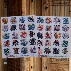 May include: Two sticker sheets featuring colorful illustrations of Korean mythology creatures. Each sticker showcases a unique design, including dragons, tigers, and mythical figures. The text "Korean Mythology 2025" is printed at the bottom of the sheets.