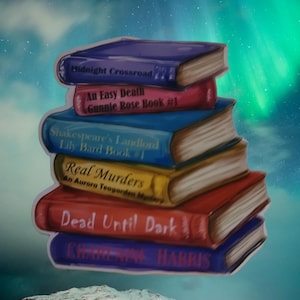 May include: A stack of six colorful paperback books with titles including "Midnight Crossroad", "An Easy Death", "Shakespeare's Landlord", "Real Murders", and "Dead Until Dark". The books are stacked against a background of a blue and green aurora borealis.