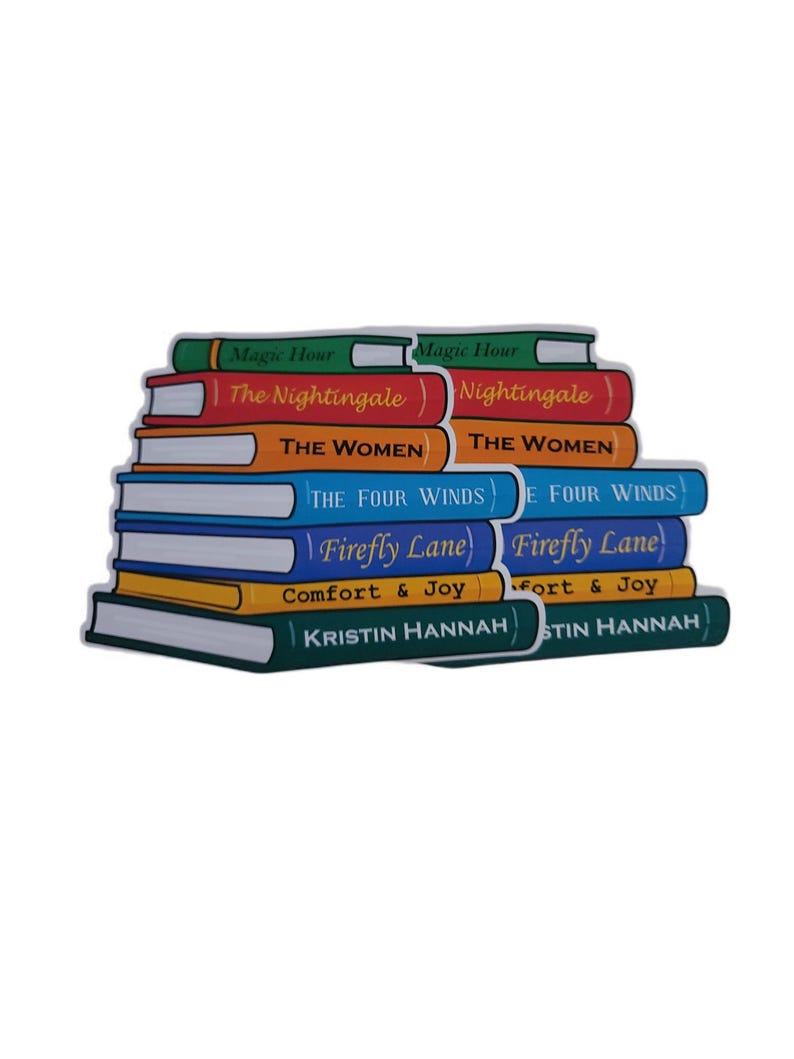 May include: A stack of colorful book-shaped stickers. The titles include "Magic Hour", "The Nightingale", "The Women", "The Four Winds", "Firefly Lane", "Comfort & Joy", and "Kristin Hannah". The stickers are in various colors, including green, red, orange, blue, yellow, and dark green.