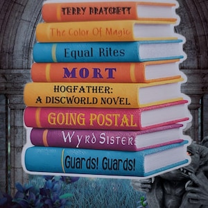 May include: A stack of colorful book-shaped stickers featuring titles by Terry Pratchett. The titles include "The Color of Magic," "Equal Rites," "Mort," "Hogfather," "Going Postal," "Wyrd Sisters," and "Guards! Guards!" The stickers have white borders and are set against a stone background.