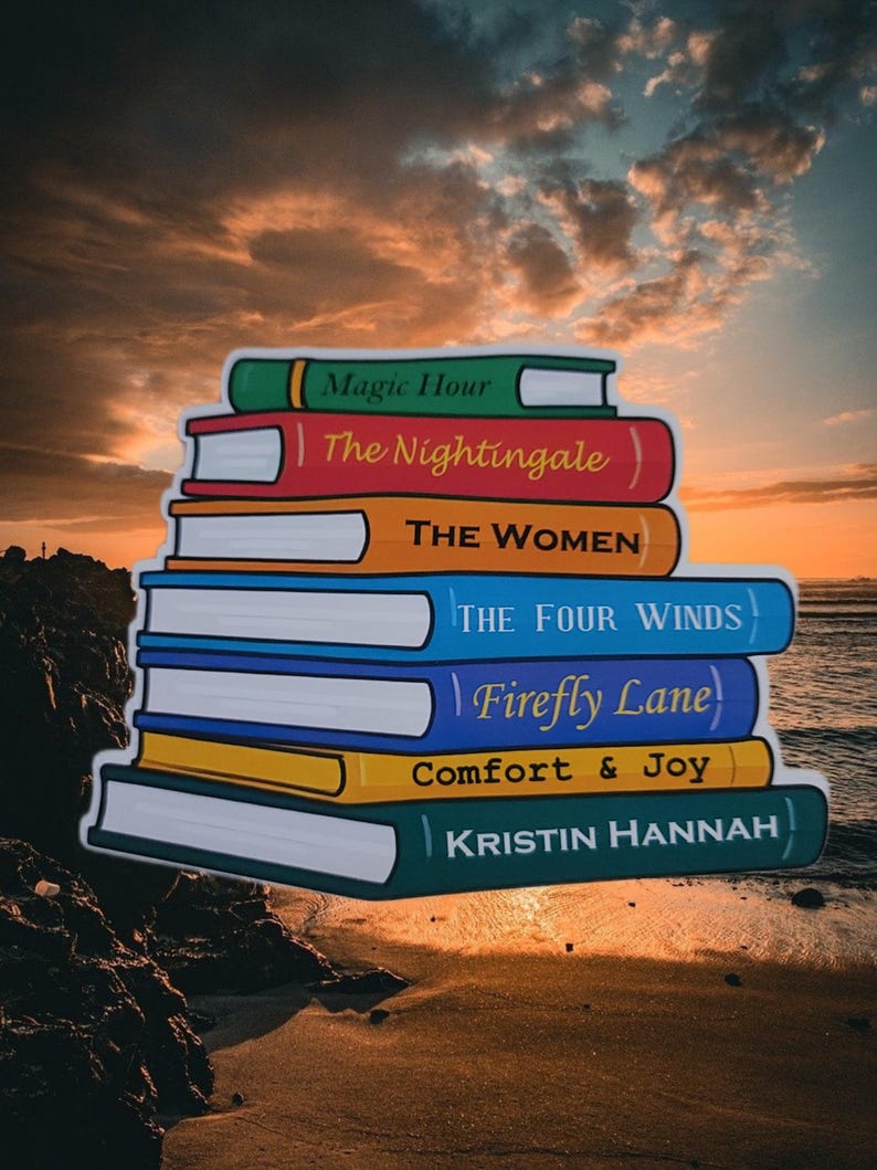 May include: A stack of colorful books with titles including "Magic Hour," "The Nightingale," and "The Women." The books are set against a sunset backdrop, with the author's name, Kristin Hannah, visible on the bottom book.