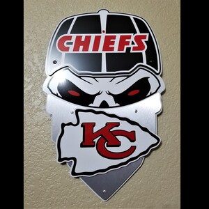 Kansas City Chiefs themed facemask wall décor.