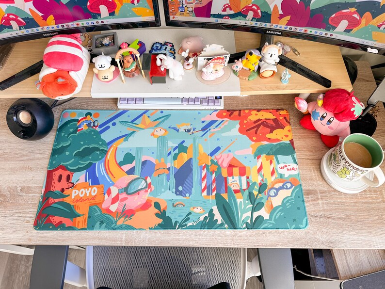 May include: A colorful desk setup featuring a vibrant mousepad with a cartoon landscape design, a keyboard, and various figurines. A plush toy and a mug are also visible. The mousepad has the text "POYO Island".