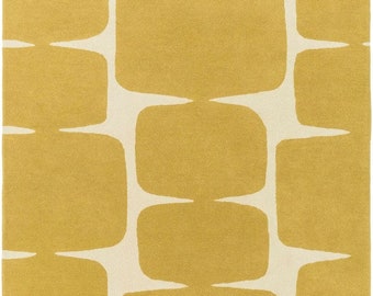 May include: A mustard yellow area rug with a geometric pattern of rounded rectangles. The rug has a white background.