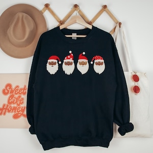 Black Santa Christmas Sweatshirt - Holiday Graphic Sweatshirt, Row of Santa Faces Shirt, Inclusive Christmas Sweater, Black Santa Claus Gift