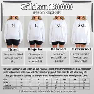 May include: White Gildan 18000 crewneck sweatshirt with size guide. The guide shows how the sweatshirt fits: fitted, regular, relaxed, and oversized. The size chart provides measurements in inches for sizes S to 5XL. The model is 5'8" and wears a size 10.
