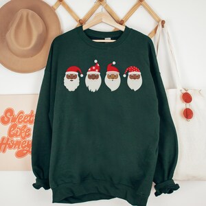 Black Santa Christmas Sweatshirt - Holiday Graphic Sweatshirt, Row of Santa Faces Shirt, Inclusive Christmas Sweater, Black Santa Claus Gift