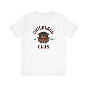 May include: White t-shirt with a black panther head graphic and the text "Childless Cat Lady Club" in red and green.