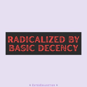 May include: A rectangular black patch featuring the text "RADICALIZED BY BASIC DECENCY" in distressed red lettering. The background is light purple, with "CUTEECOLLECTION" at the bottom.