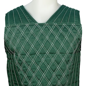 May include: A green quilted vest with white stitching in a diamond pattern.