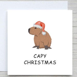 Divertente biglietto di Natale, biglietto di auguri con il capibara, Natale con i capibara, biglietti carini, biglietti divertenti, biglietto con il cappello di Babbo Natale, biglietto con il capibara, simpatico biglietto con un animale