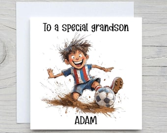 May include: A greeting card with a cartoon illustration of a boy kicking a soccer ball. The boy is wearing a blue and red striped shirt and shorts. The card reads "To a special grandson" and "ADAM".