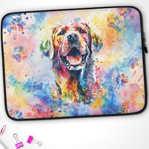 May include: A colorful watercolor painting of a Labrador Retriever dog with a happy expression. The dog is surrounded by splashes of pink, blue, yellow, and green paint.