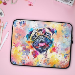 May include: A colorful laptop sleeve featuring a watercolor painting of a pug dog with a happy expression. The background is a mix of pink, yellow, blue, and green.