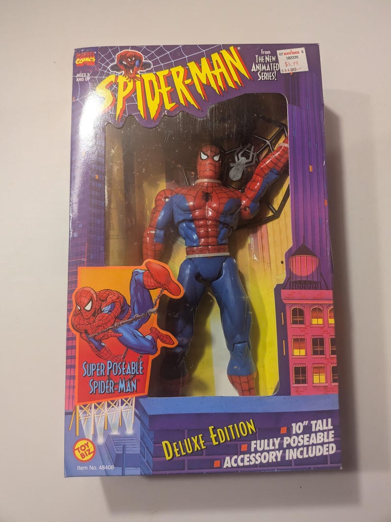 May include: A red and blue Spider-Man action figure with a web accessory. The figure is 10 inches tall and fully poseable. The packaging features the Spider-Man logo and the text "Deluxe Edition".