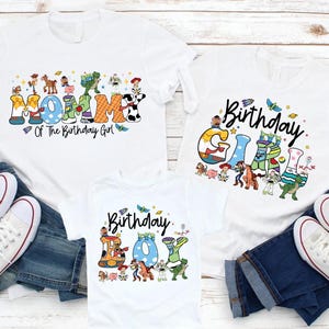 May include: White t-shirts with colorful graphics and text. One shirt says "Mommy Of The Birthday Girl", another says "Birthday Girl", and the third says "Birthday Boy". The shirts are paired with blue jeans and white sneakers.