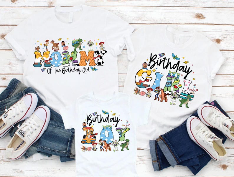 May include: White t-shirts with colorful graphics and text. One shirt says "Mommy Of The Birthday Girl", another says "Birthday Girl", and the third says "Birthday Boy". The shirts are paired with blue jeans and white sneakers.