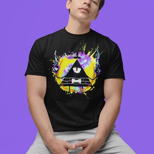May include: A black t-shirt with a colorful graphic of a triangle-shaped character with one eye, wearing a bow tie. The character is surrounded by colorful paint splatters.