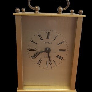 Vintage Unistar Quartz Clock West Germany. Brass Carriage Working good Height 14 cm