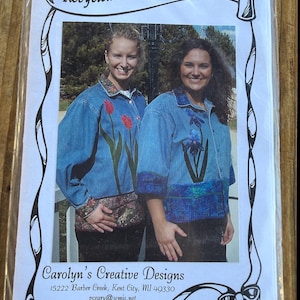 May include: A sewing pattern for a Recycled Denim Shirt Jacket, #CCD121, by Carolyn's Creative Designs. The cover features two denim shirts with floral appliqués, including red tulips and a blue iris, with patterned fabric trim at the cuffs and hem.