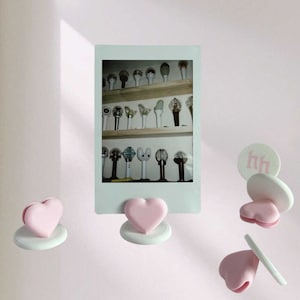 Soporte para Polaroid/cargador superior con dije de corazón