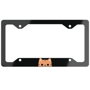 May include: Black metal license plate frame with a cute orange cat face peeking out from the bottom.