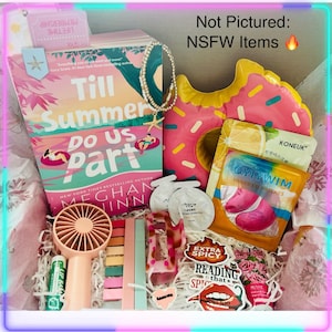 May include: A gift box filled with a book titled "Till Summer Do Us Part", a pink donut-shaped inflatable, beauty products, and accessories. Includes a fan, lip balm, stickers, and a bracelet. The box is lined with tissue paper.