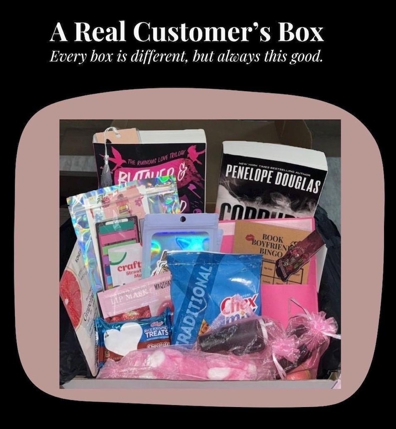 May include: A Real Customer's Box filled with various items. The box contains books, snacks, and beauty products. The text on the box reads "A Real Customer's Box" and "Every box is different, but always this good."