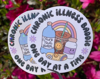 May include: Two white round stickers with a rainbow, a water bottle, a coffee cup, a pill bottle, and a camera. The text on the stickers reads "Chronic Illness Baddie One Day At A Time".