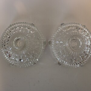 Pair of cut glass candlestick holders, footed
