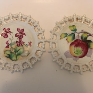Pair of Lefton China reticulated 7.5&quot; hanging plates, one fruit, one flowers, with fleur de lys lattice work