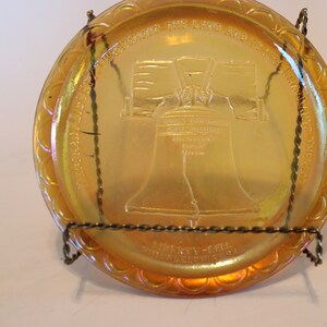 Carnival glass Liberty Bell 8" orange plate, 1976