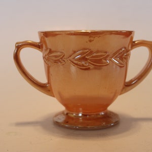 Peach lusterware Fire King sugar bowl with two handles