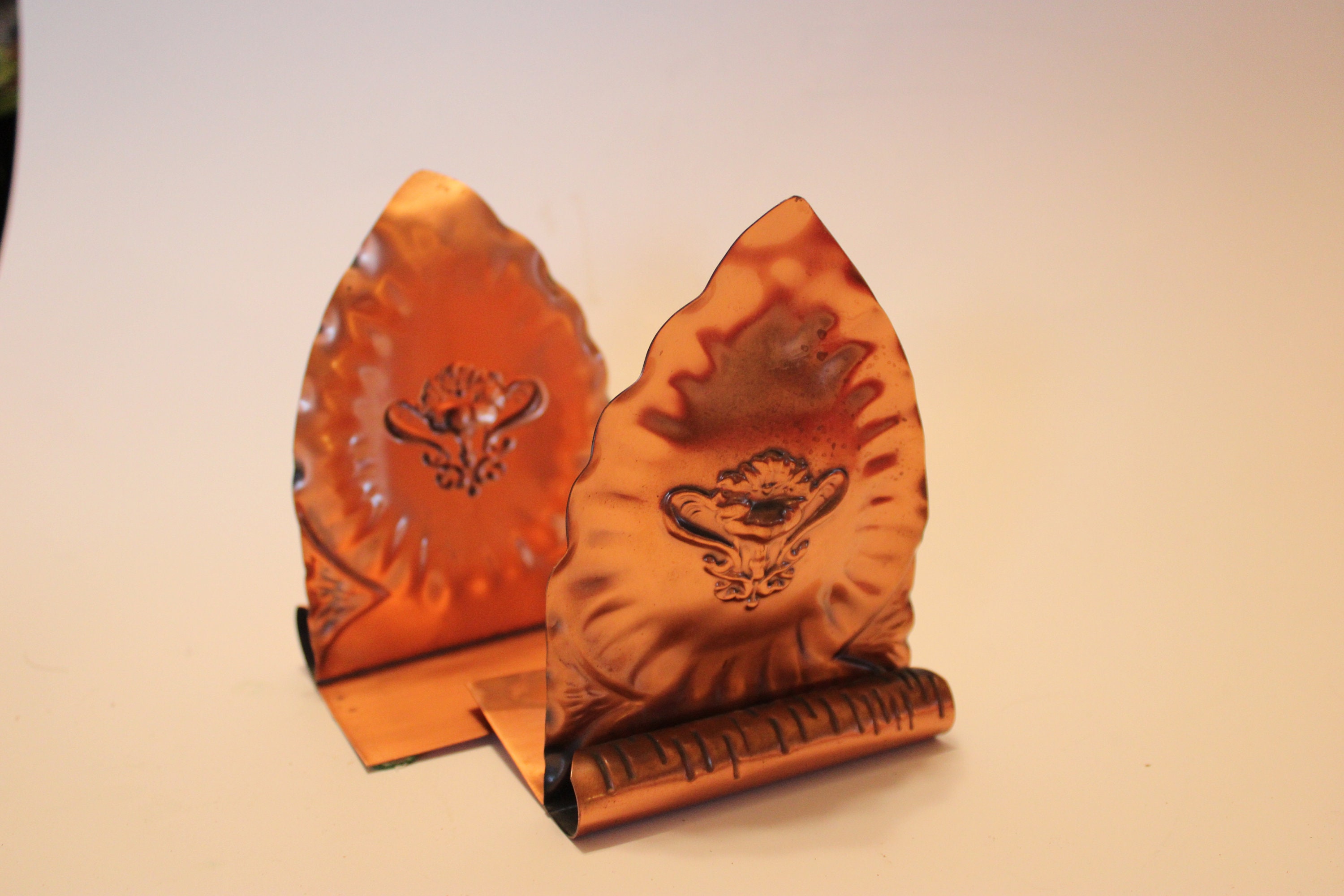 Gregorian solid copper bookends, 4" wide with floral motif