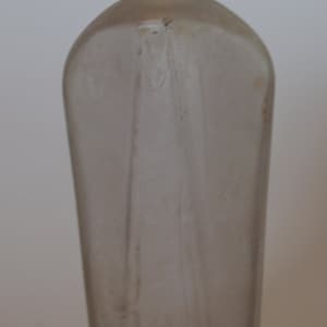Syrup bottle, clear glass, c.1890s, with small floral design