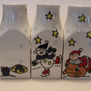 Set of three Ganz ceramic Christmas milk bottles, depicting a joined-up Christmas scene of your choice