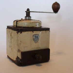 Peugeot Freres antique coffee grinder, metal casing, some wear, emblem worn, 1950s
