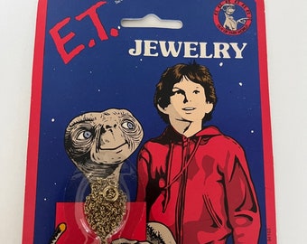 1980s NOS E.T. the Extra-Terrestrial enamel necklaces, on card in original packaging, movie memorabilia