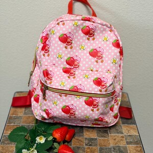 Strawberry Shortcake Floral Themed Mini Backpack With‎ Zipper Front Pocket Amazon.com | Loungefly Strawberry Shortcake Mini Backpack  main image 4