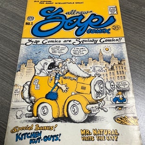 May include: A comic book cover with a yellow car and a man with a long white beard. The cover is titled "Zap Comics are Squinky Comics!" and features the text "All New Zap Comics" and "Special Bonus! Kitchen Kut-Outs!" The cover also features the text "Mr. Natural Visits the City".