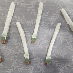Chocolate coated dinosaur pretzel rods, dino party favor, dessert table, dino birthday, dino party favor, palm leaf chocolate coated pretzel