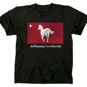 May include: Black t-shirt with a white silhouette of a running horse on a red background. The text "deftones//worldwide" is printed below the image.