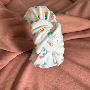 Bandeau noué pour une couverture Ducky