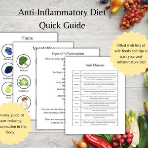 May include: A stack of printed guides titled "Anti-Inflammatory Diet Quick Guide" with text and illustrations of fruits and vegetables. The guides are accompanied by fresh produce, including bananas, grapes, and tomatoes. Text on the guides includes "Fruit Glossary".
