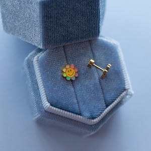 Smiley face screwback earrings colorful flower