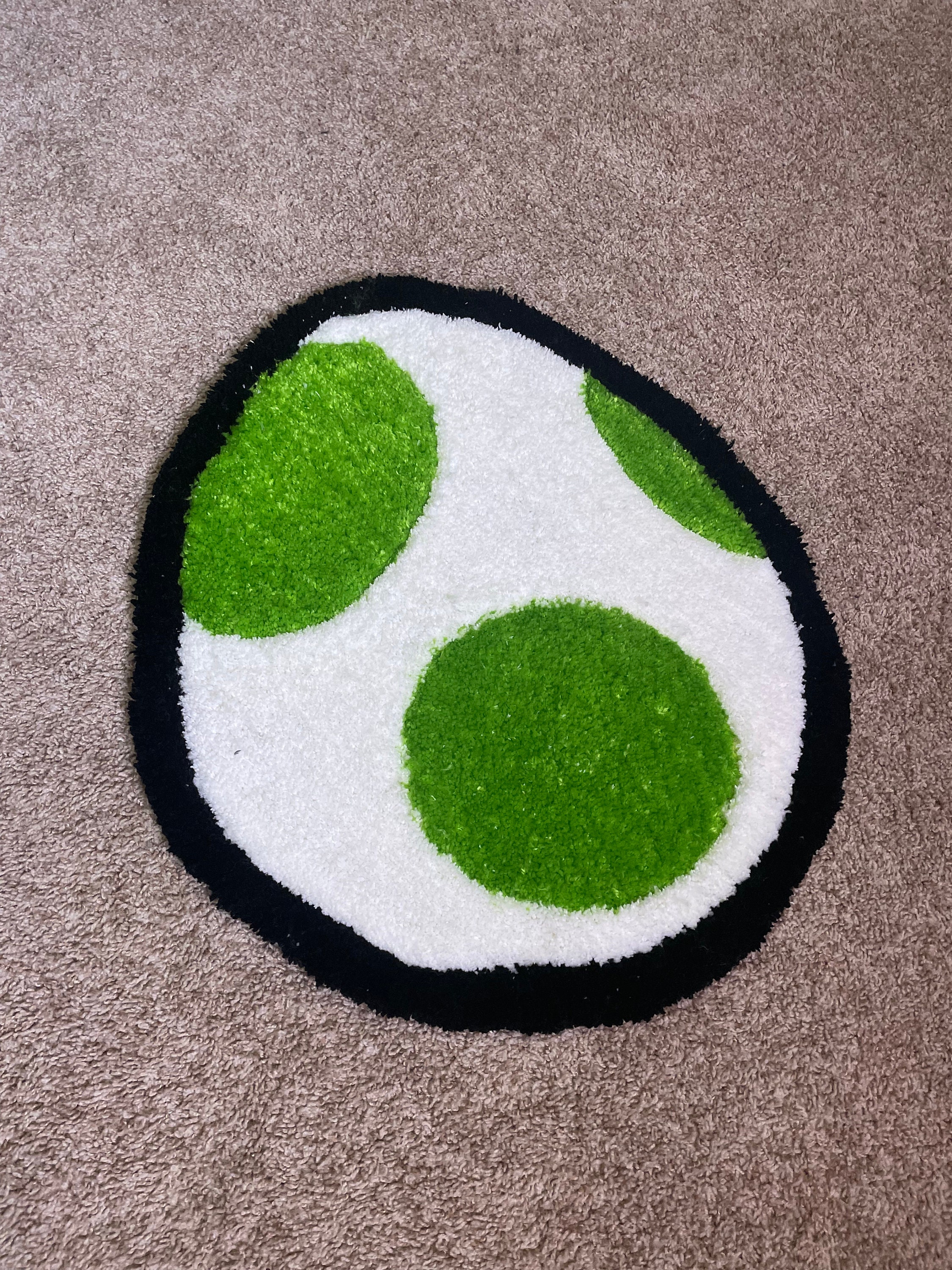 I made a tiny Yoshi egg rug to try burlap! : r/Tufting