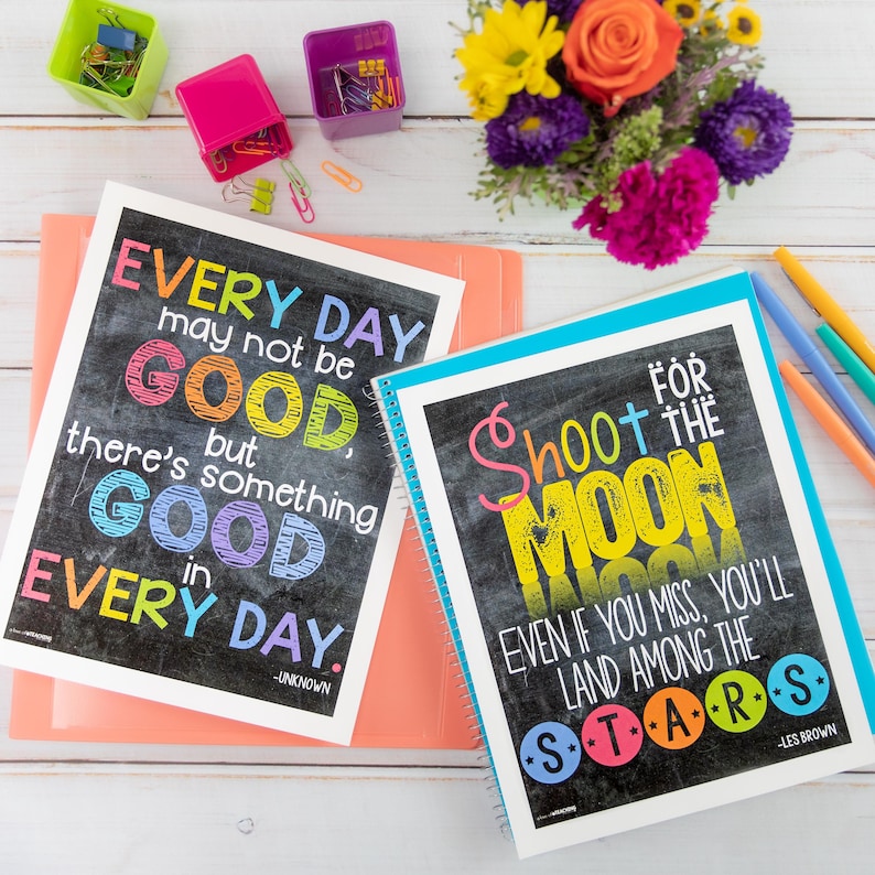 May include: Two inspirational posters with colorful text on a black chalkboard background. The first poster says "Every day may not be good, but there's something good in every day." The second poster says "Shoot for the moon. Even if you miss, you'll land among the stars."