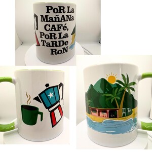May include: Three white ceramic mugs with green rims. The first mug has black text that reads "Por La Ma&ntilde;ana Caf&eacute;, Por La Tarde Ron". The second mug has a green coffee cup and a red, white, and blue coffee pot with a star on it. The third mug has a green mountain, palm trees, a yellow sun, and a blue ocean.