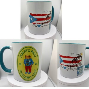 May include: Three white ceramic mugs with teal rims. The mugs feature different designs related to Puerto Rico. One mug has a frog wearing a blue shirt and red pants, another has a Puerto Rican flag and palm trees, and the third has a Puerto Rican flag and the text "I love Puerto Rico".